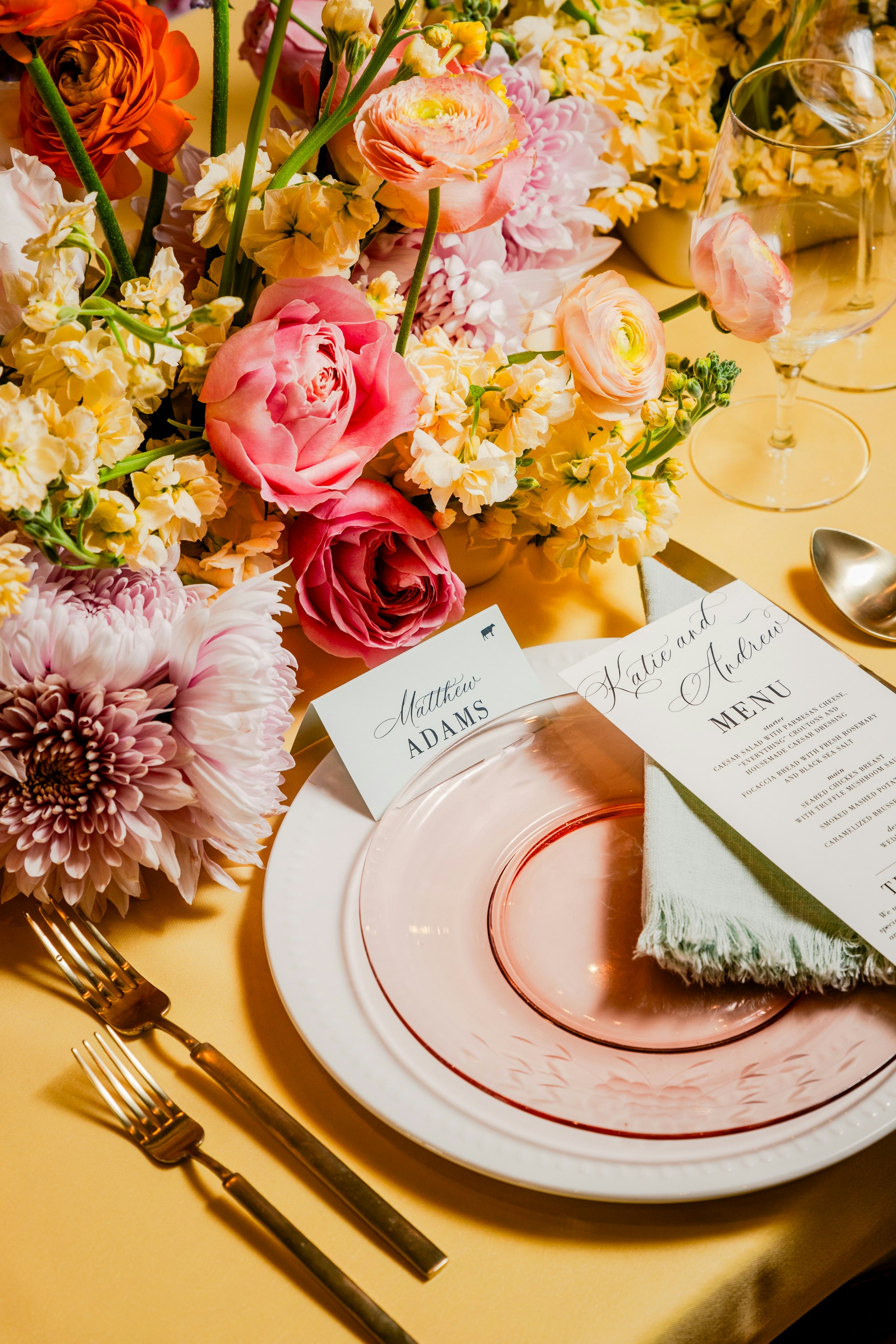 Colourful birthday and bridal shower floral centrepiece on a celebration table